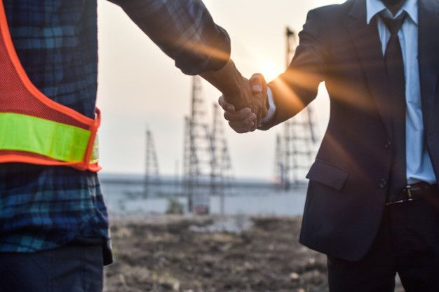 Premium Photo _ Engineer two people shake hand agreement project estate building construction